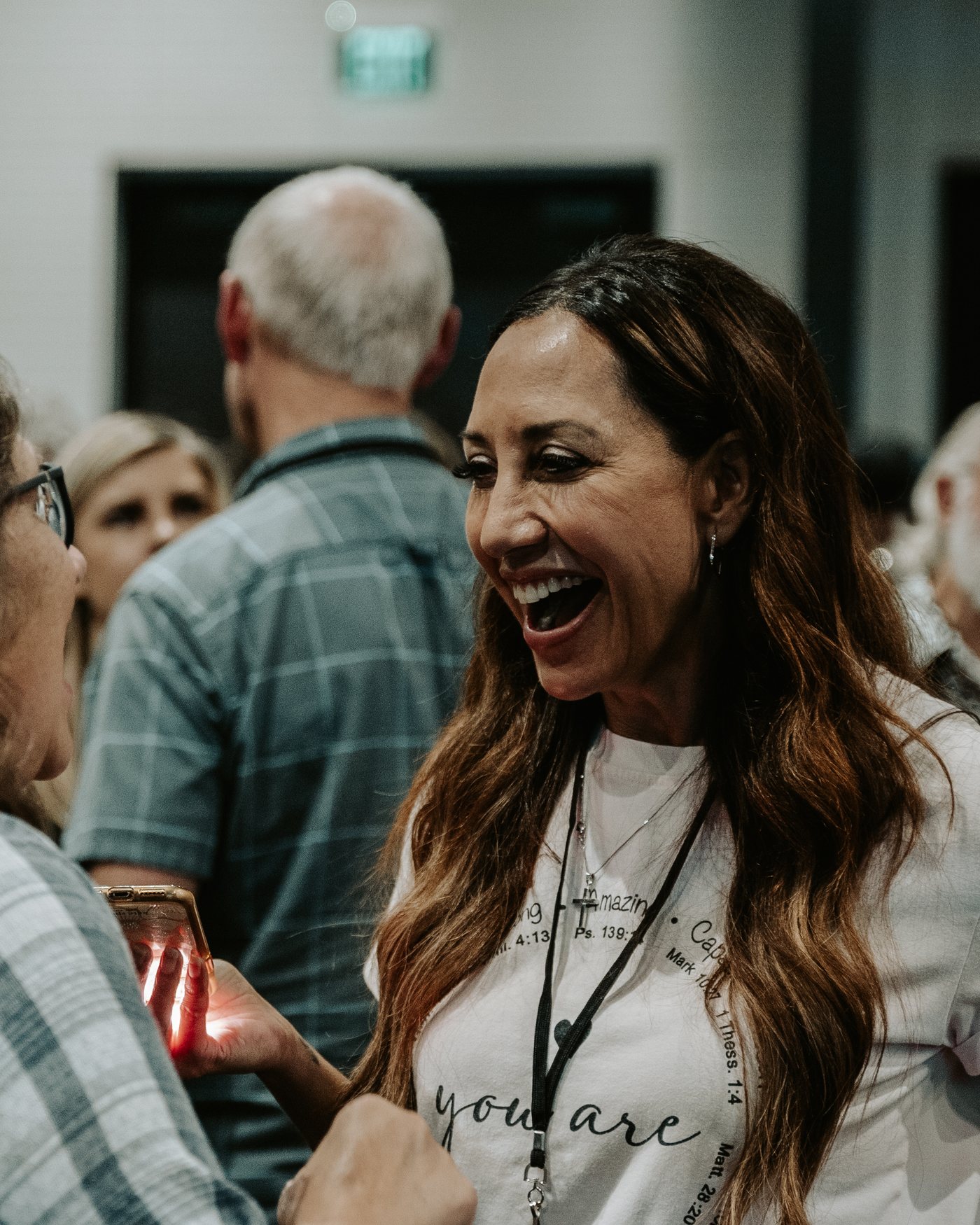 An attendee laughing mid-conversation during an activation at School of Prophetic Training.